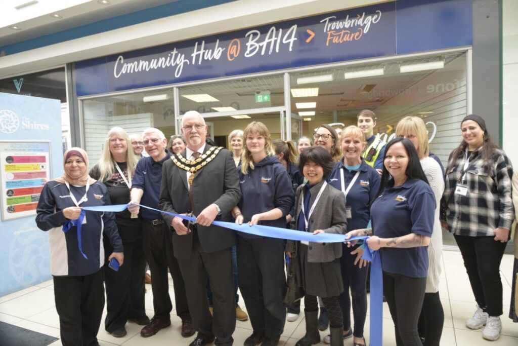 Trowbridge Mayor Cllr Stephen Cooper officially opens the Trowbridge hub at the Shires with the staff.