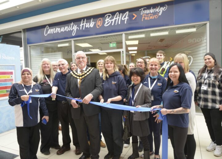 Trowbridge Mayor Cllr Stephen Cooper officially opens the Trowbridge hub at the Shires with the staff.