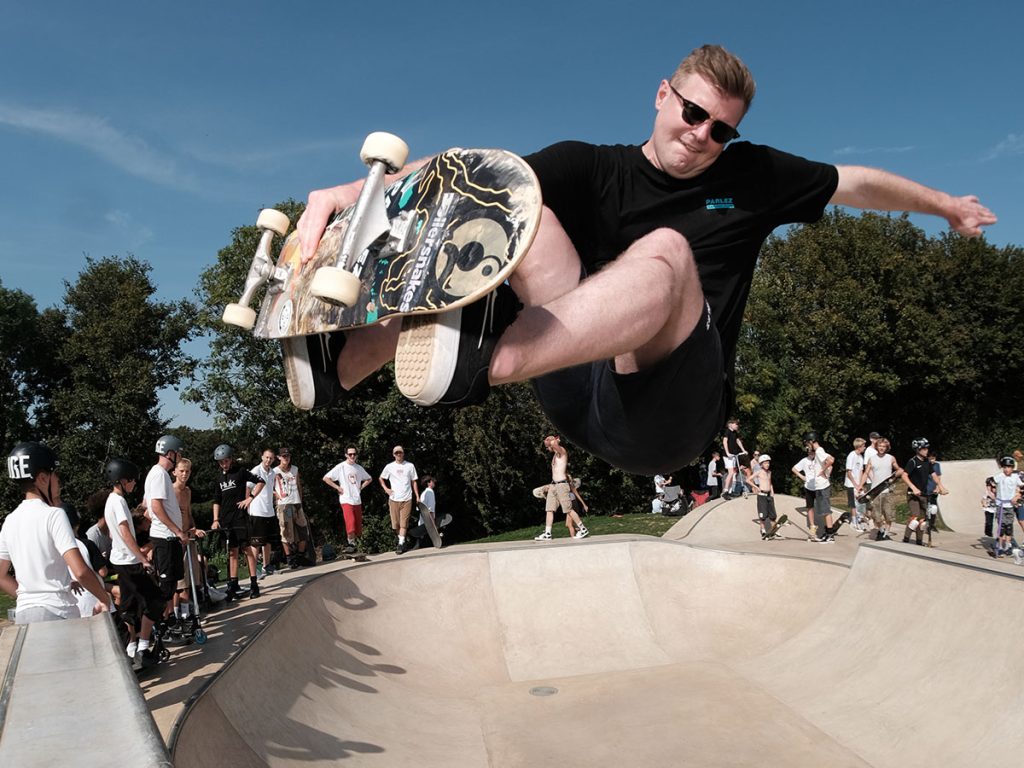 Young man on a skateboard in the air at bradford on avon skatepark