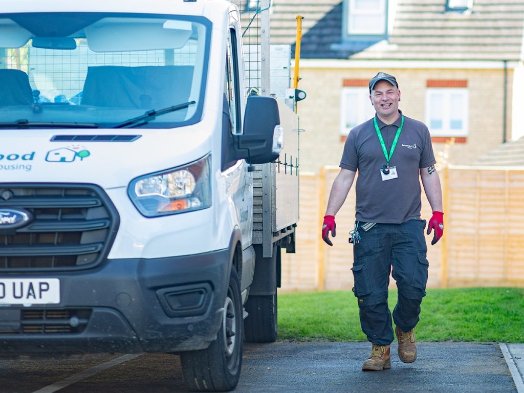 Selwood Housing neighbourhood caretaker Lance walking beside Selwood Housing van