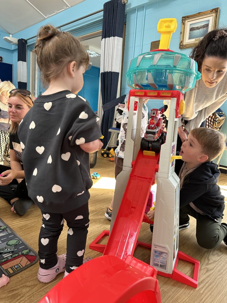 Children at the baby & toddler group enjoying the new toys