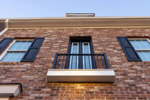 A balcony on a brick building