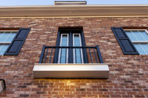 A balcony on a brick building