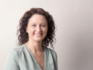 Professional headshot of a woman smiling